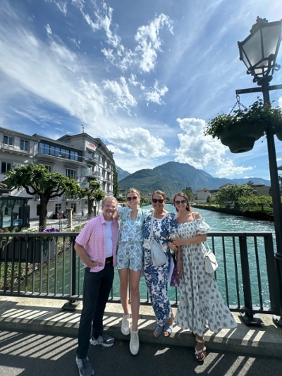 Dr. Summer Morrissette poses with her parents and sister on a bridge in Italy.